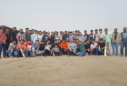 GBS team near desert with cricket bat