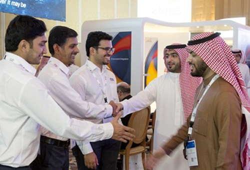 GBS team shaking hands at an exhibition